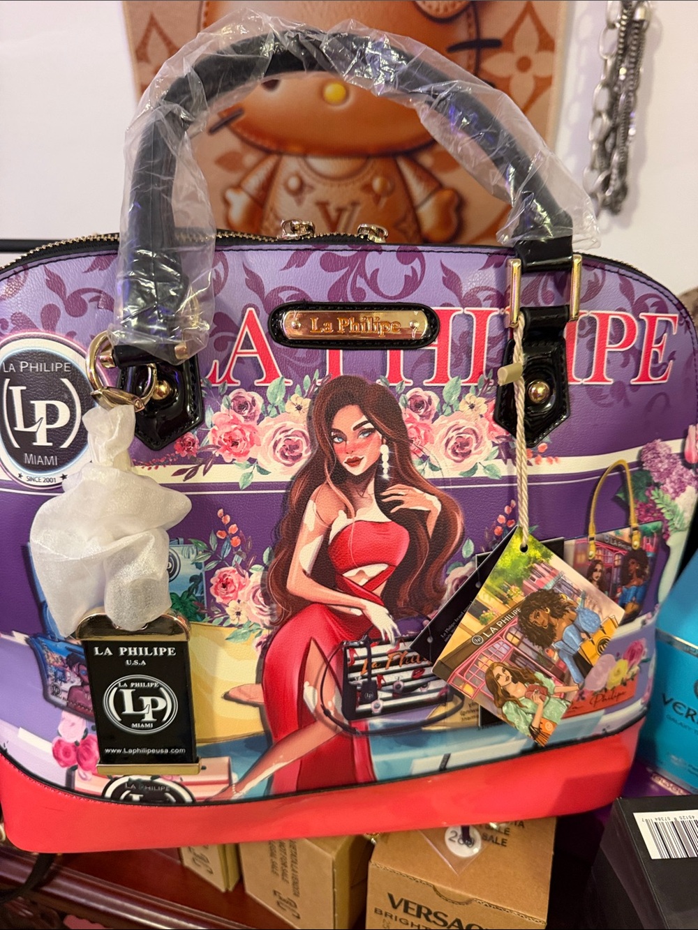 LaPhilipe Lady in the City Purple Printed Satchel with Red Accent